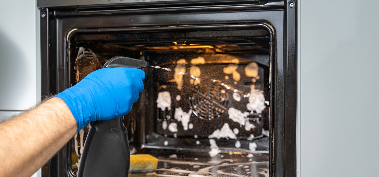 cleaning and spraying oven inside