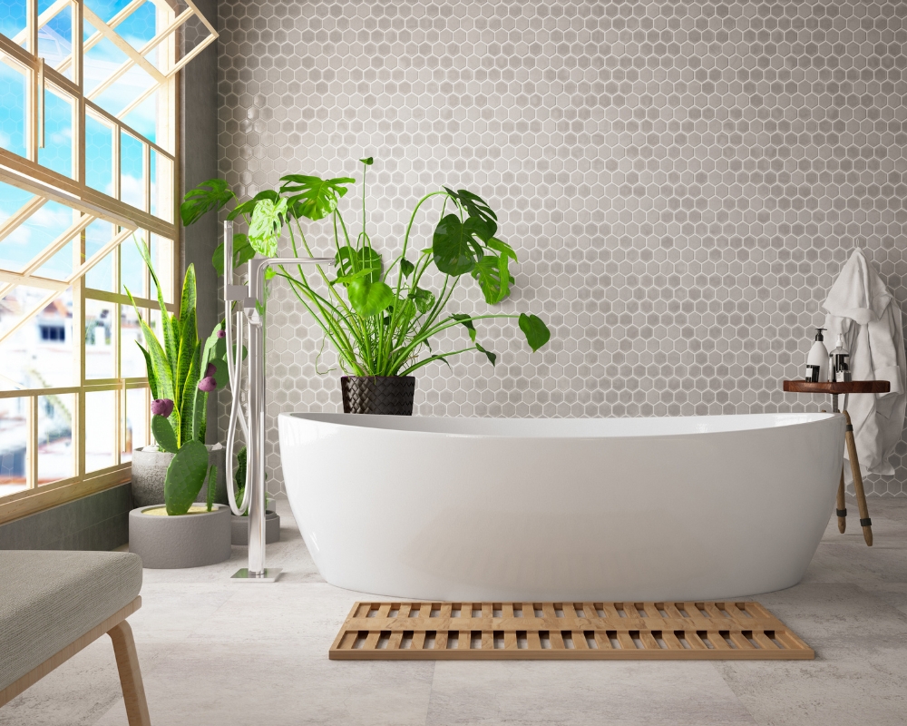 image of a bathroom with plants and a freestanding bath for biophilia