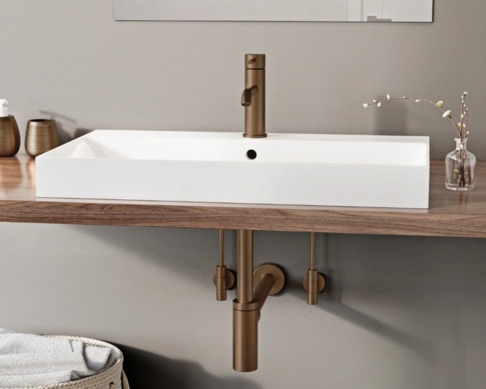 image of brushed bronze taps and bottle tap with countertop sink