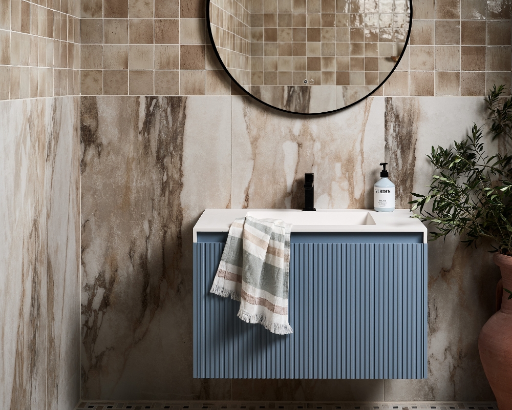 image of a beige mediterranean style themed bathroom with blue fluted vanity unit