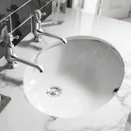 image of a crosswater undermount inset basin in white marble worktop with deck mounted taps