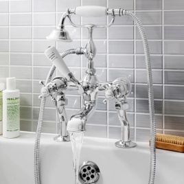 image of crosswater deck mounted bath taps on side of bath with running water